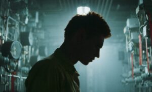Silhouette of a man in a poorly lit hazy maintenance room. Shot with a TLS Leica cine lens.