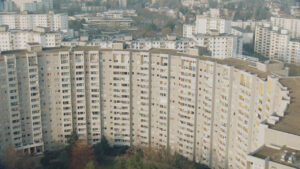 Panoramic aerial shot of a large concrete block of flats called Gropiusstadt in Berlin. The Vintage Look is created by the Cooke Varotal lens.