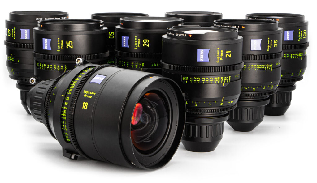 Collection of camera lenses arranged neatly.