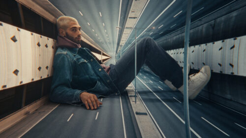 Giant man chilling on an empty highway. Shot on ARRI Ultra Primes. 