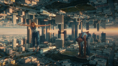 Two people doing workout in a mirrored modern american city. Shot on ARRI Ultra Primes. 