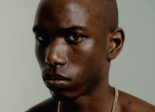 A picture of a young man in stark light.