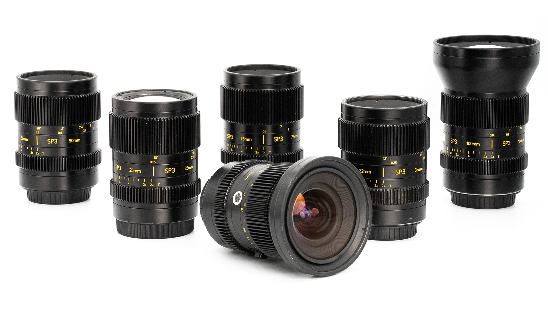 Full set of Cooke SP3 mirrorless cine lenses displayed on a white background, including 18mm 25mm, 32mm, 50mm, 75mm and 100mm focal lengths with E-mount and PL-mount capability.