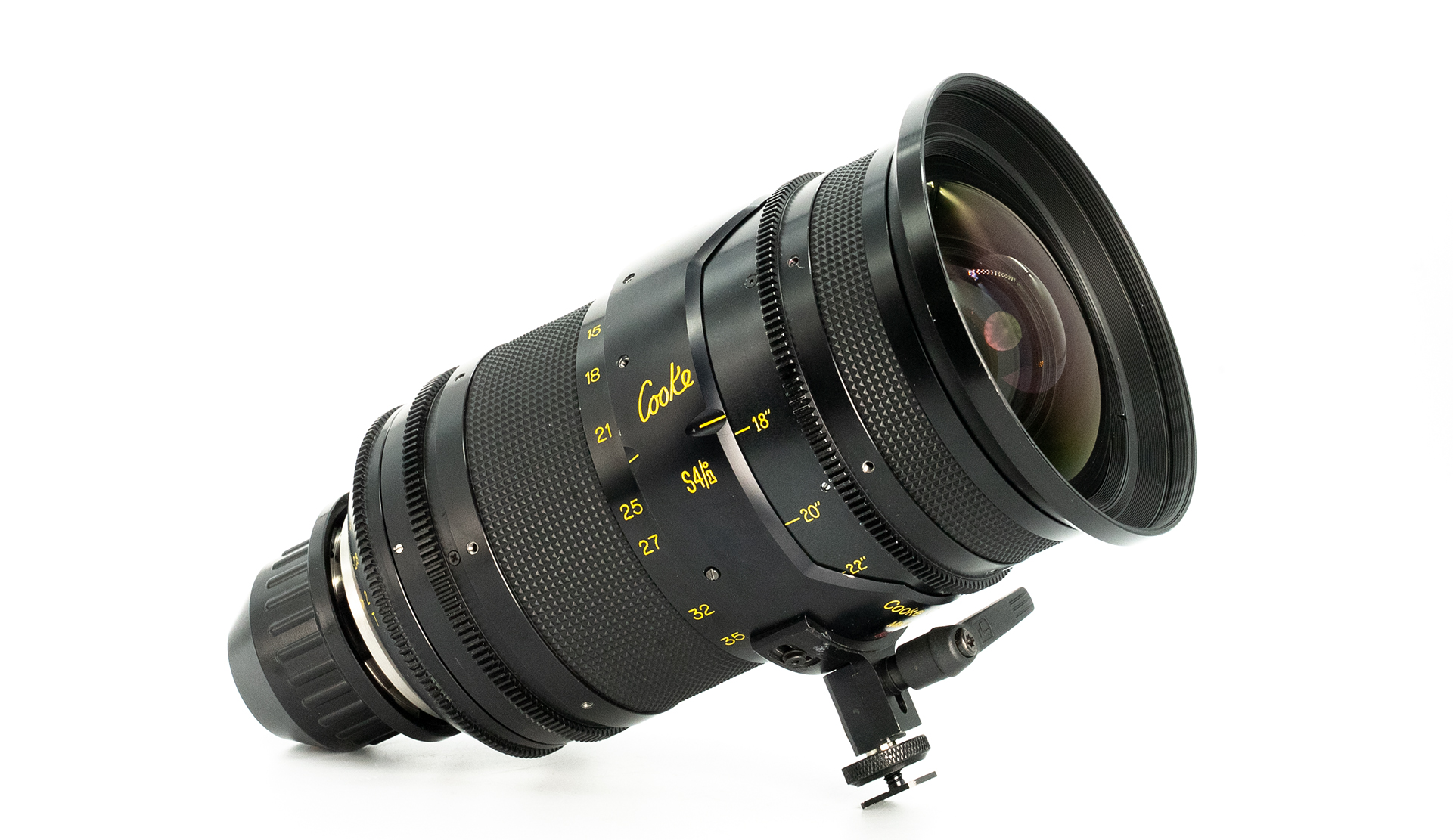 Cooke S4/i 15–40mm CXX zoom lens, angled view on a white background, showing focus, zoom and iris rings with yellow markings and front element.