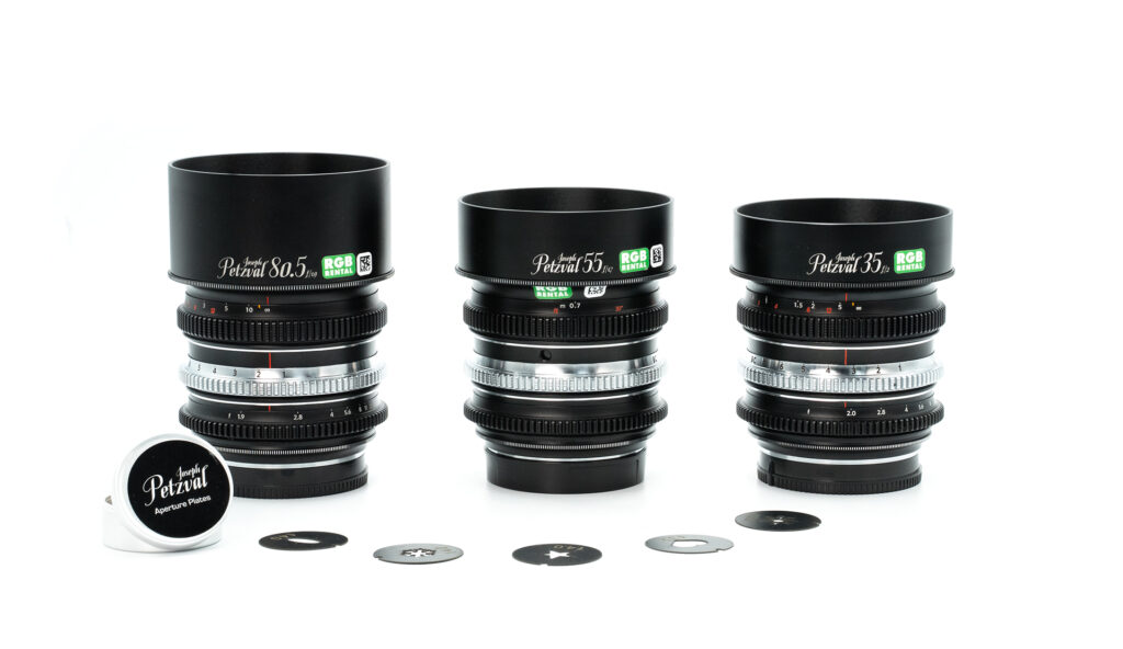 Three Petzval camera lenses displayed